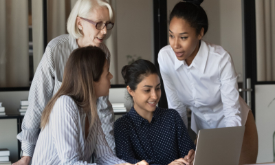 Four women deciding what software they will invest in with their Help to Grow grant