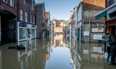A high street has been flooded by rain