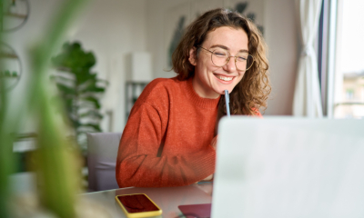 A young woman is working on her side hustle and earning great money