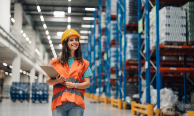 A woman is checking the warehouse for exports