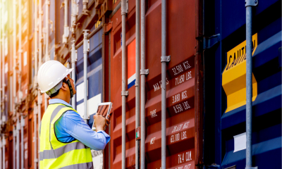 A port controller inspects shipping containers