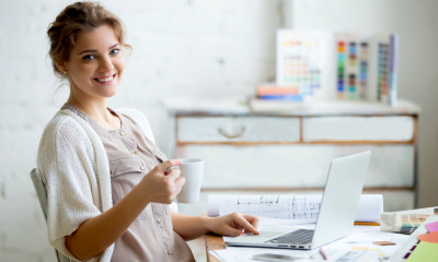 A businesswoman smiles after successfully claiming a tax refund