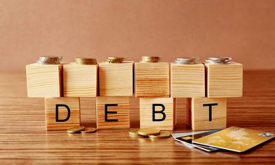 Collecting debts - checklist The letters DEBT on wooden blocks wiht more blocks being stacked on top