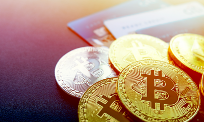 Crytocurrency and cryptoassets including bitcoin coins and credit cards.