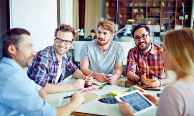 Employees in small business discussing employee National Insurance