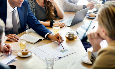 Factoring and invoice discounting Team around table examining financials
