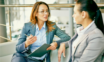 A female manager talks to an employee about her financial wellbeing