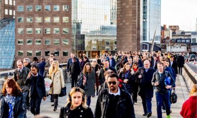 Commuters walking across London bridge