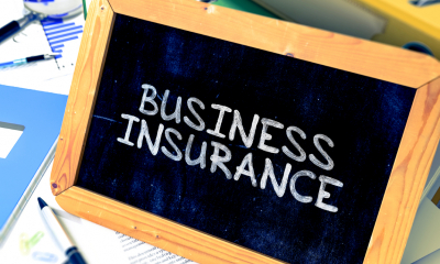 Getting business insurance - checklist Business insurance written on blackboard