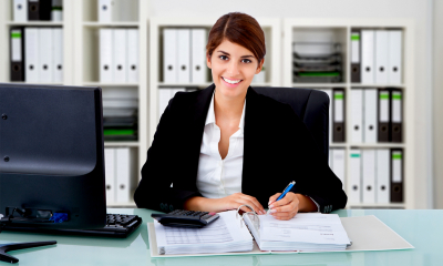 Getting the best value from your accountant - checklist An accountant completes paperwork for a client