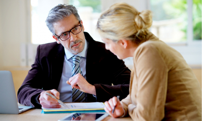 A HR manager negotiates a pay increase request with a female employee