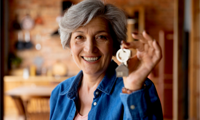 An female landlord holds the keys to one of her rental properties