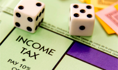 Two dice land on the Income tax space on a Monopoly board