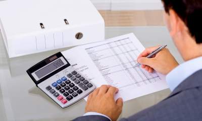 Plan your long-term financial security Man working out financial figures