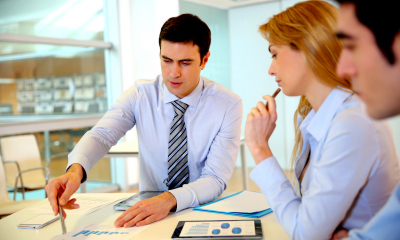 Small business team calculating corporation tax