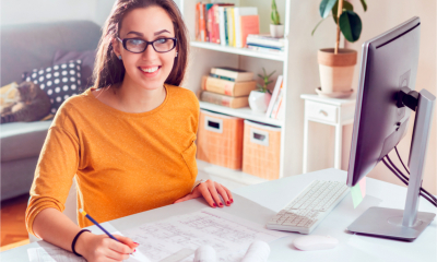 Woman calculating corporation tax for her business