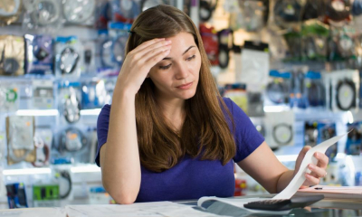A female business owner looking over her business expenses