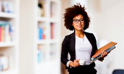 Business woman holding business files and company records