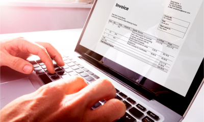 A businessman issuing customer invoices