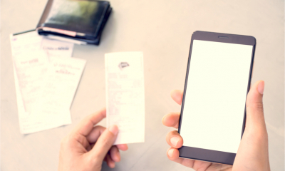 A man prepares to enter his expenses receipts to an app