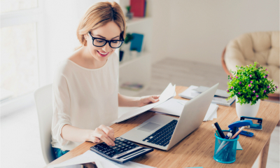A woman uses a tax calculator