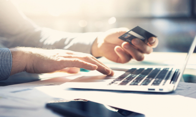 A businessman pays a tax instalment under his HMRC Time To Pay arrangement