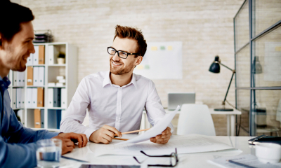 A professional adviser works with a client after setting up his insurance