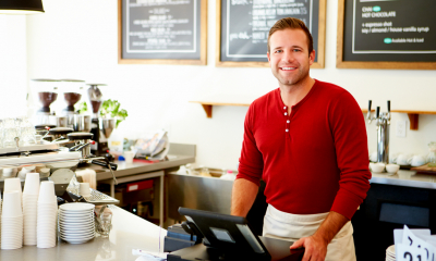 A cafe owner works happily knowing he is backed up by insurance