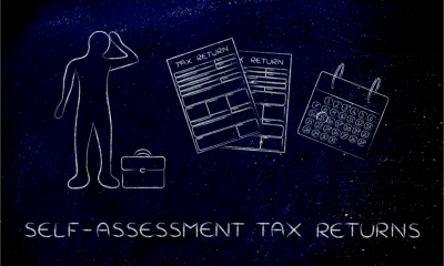 A chalk board picturing a man working out whether he should pay his tax now or later
