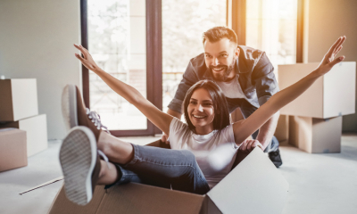 A young couple move in together, after pooling their financial resources to buy a house.