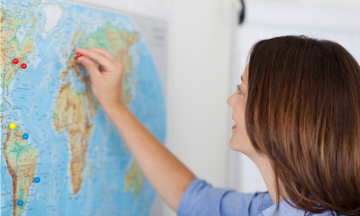 A freelancer looks at a map of the world