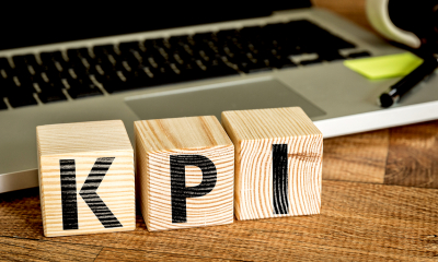 Using performance indicators - checklist wooden blocks spelling KPI