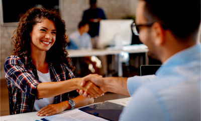 Young woman signing an employment contract