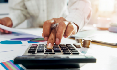 A woman calculates her VAT bill