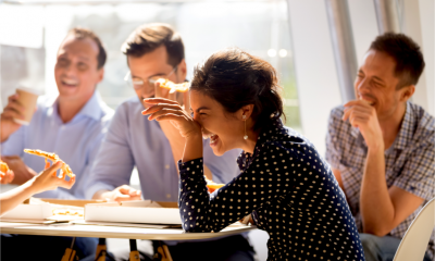 Colleagues laughing during a lunch break