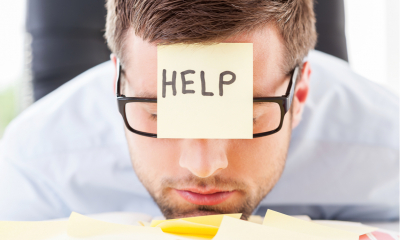 Stressed employee sitting at his desk